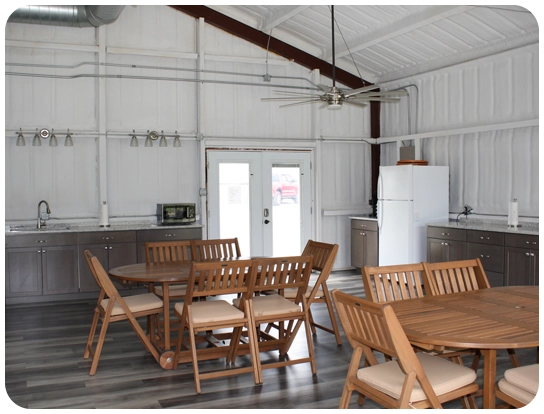 A room with many chairs and tables in it