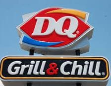 A dairy queen sign sitting under a grill and chill.