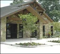 A building with a tree in front of it