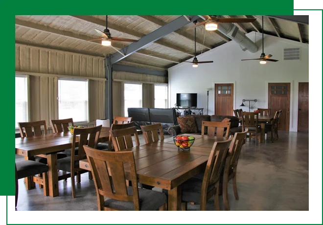 A large room with many wooden chairs and tables.