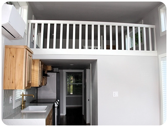 A kitchen with a sink and cabinets in it