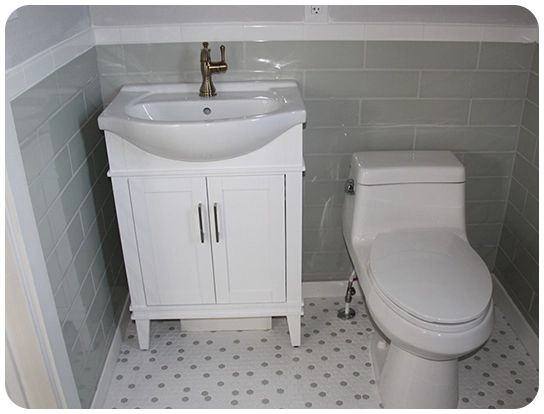 A bathroom with a toilet and sink in it