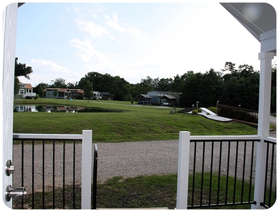 A view of a grassy area from behind the fence.