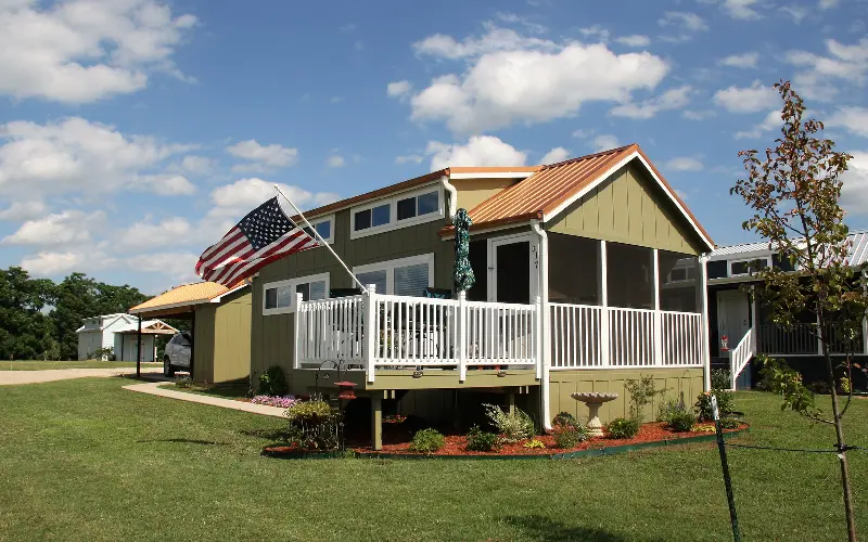 A house with an american flag on the roof.