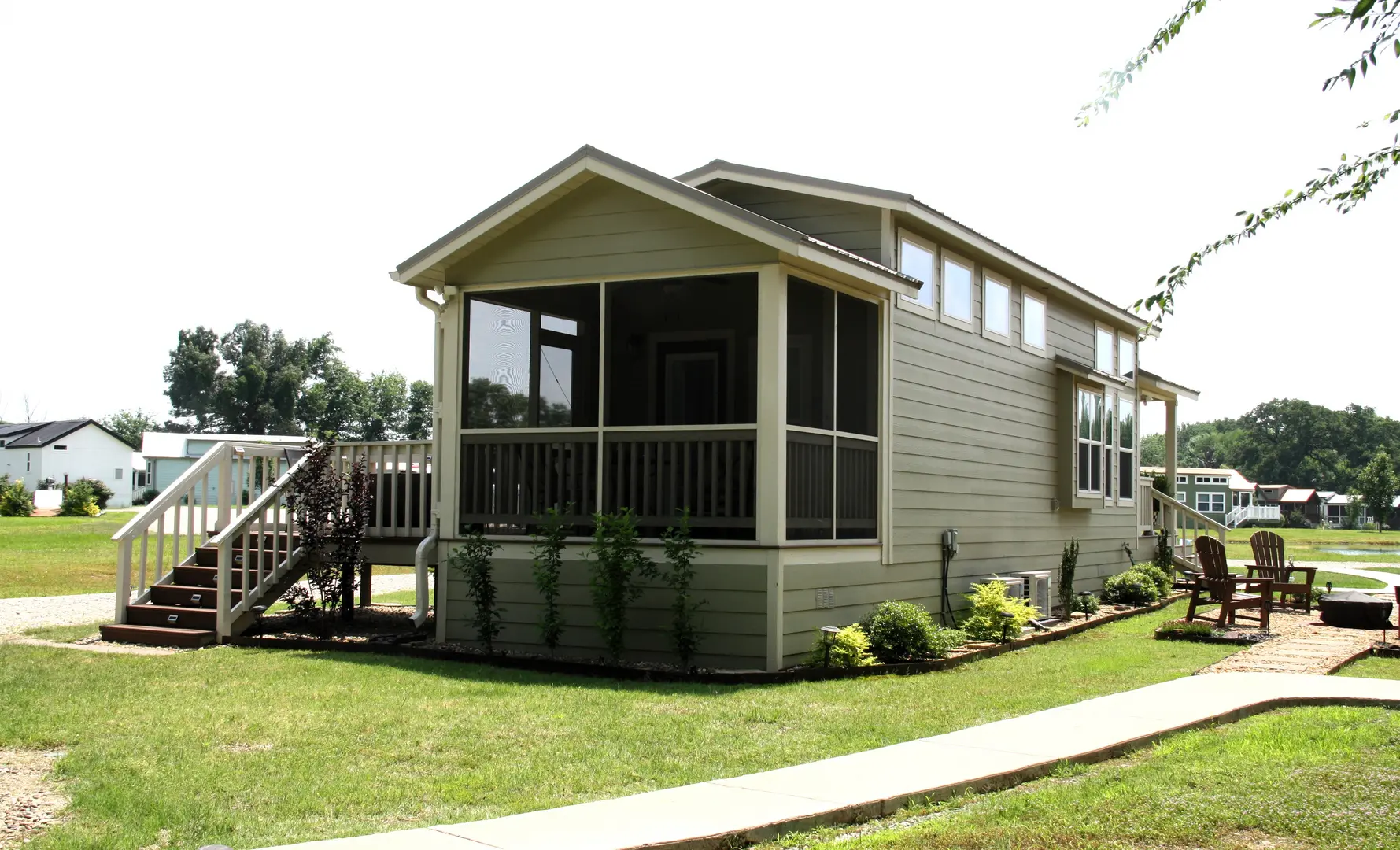 A small house with a porch and screened in front.