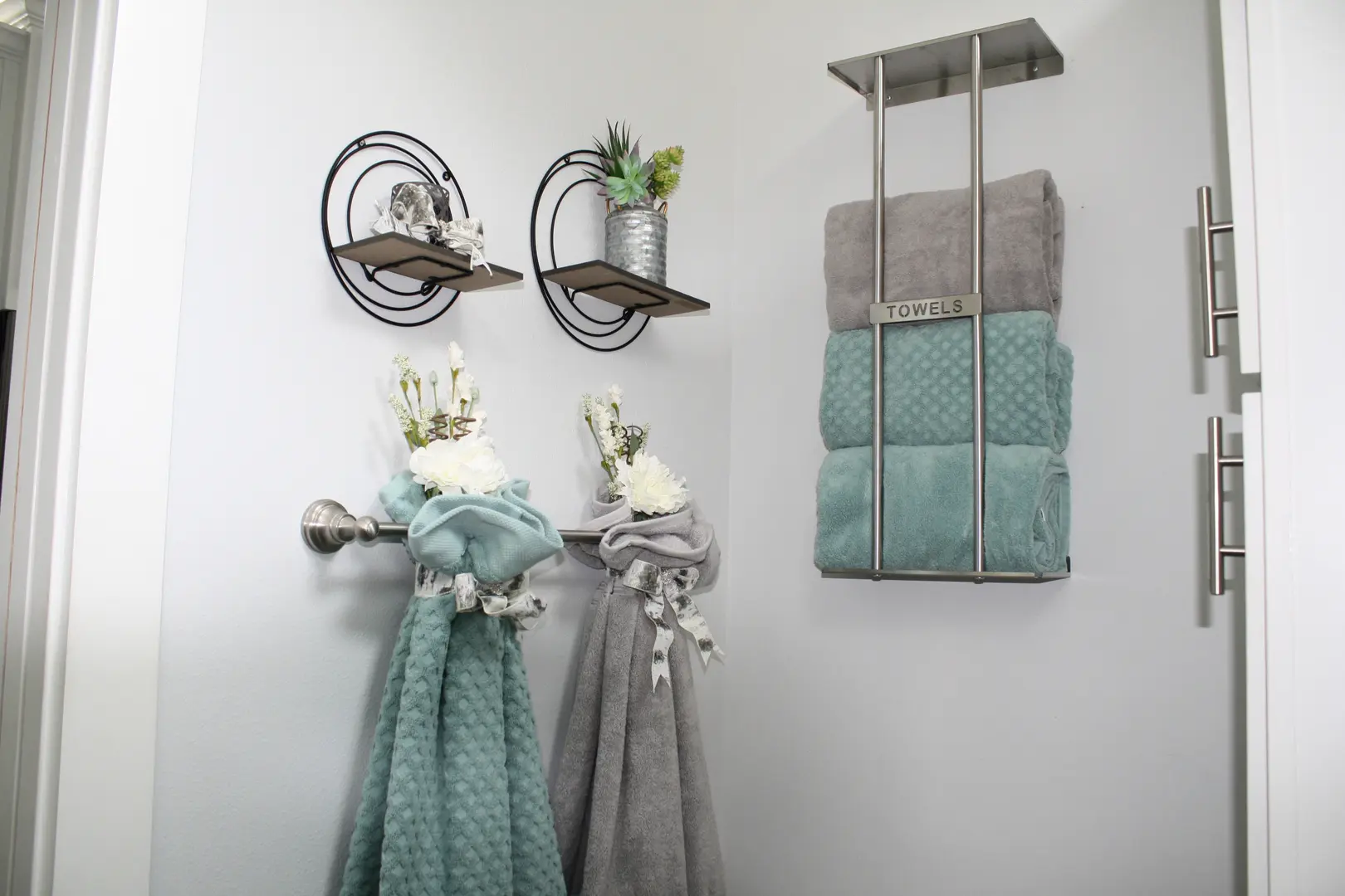 A bathroom with towels hanging on the wall.