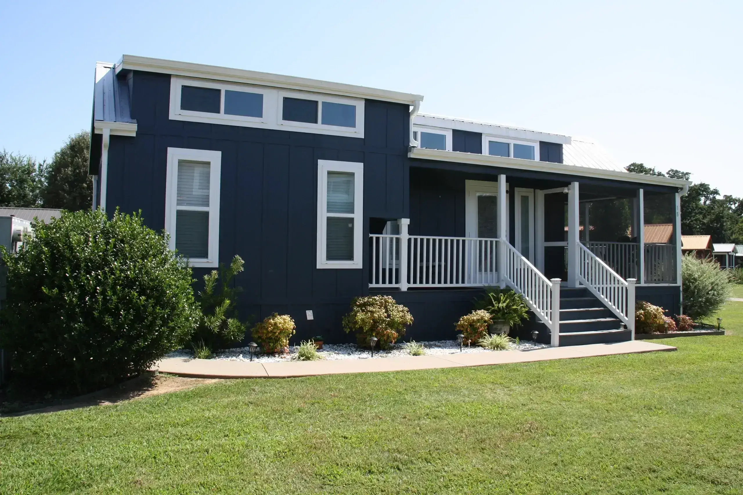 Blue house with white trim and porch.