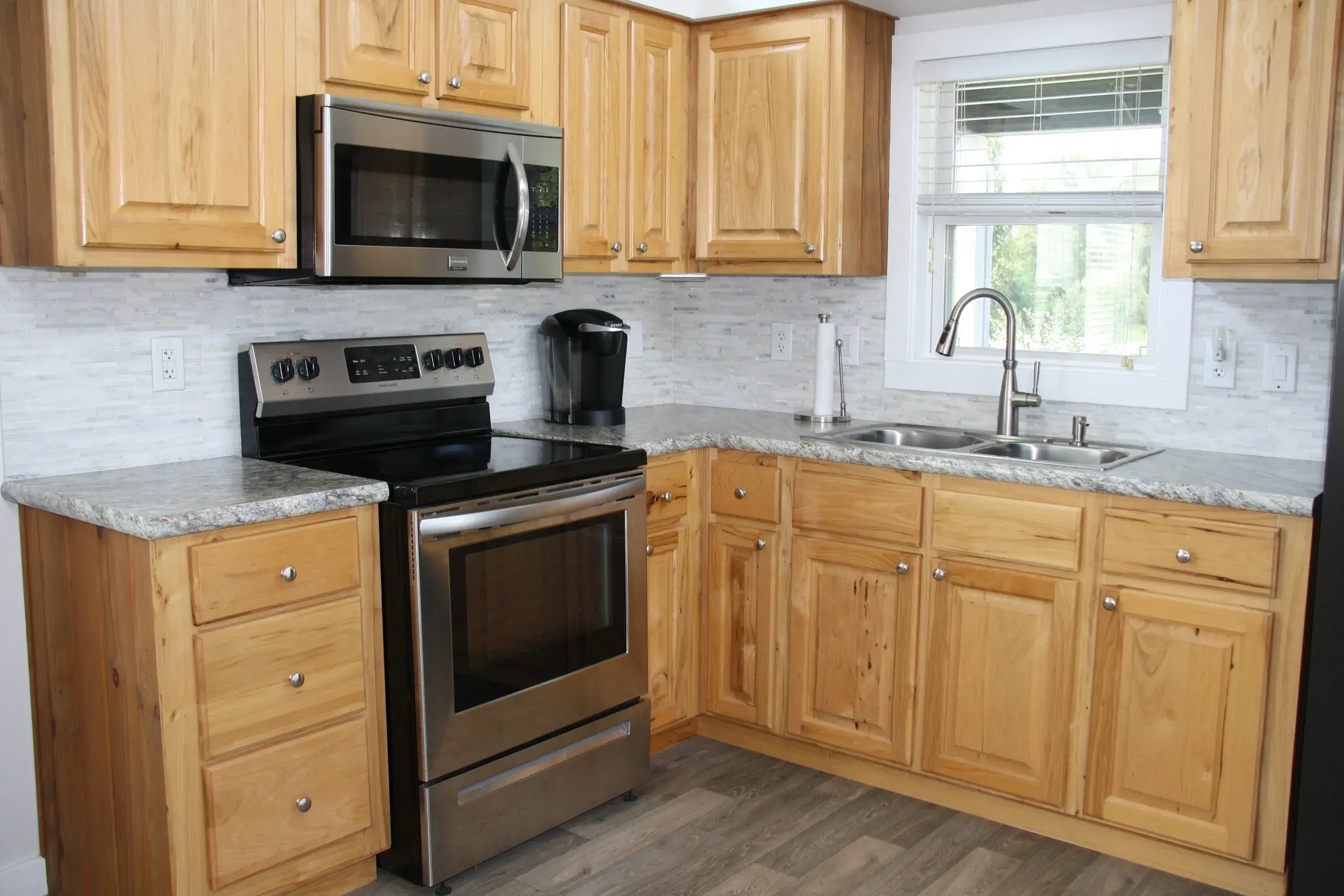Kitchen with stainless appliances and wood cabinets
