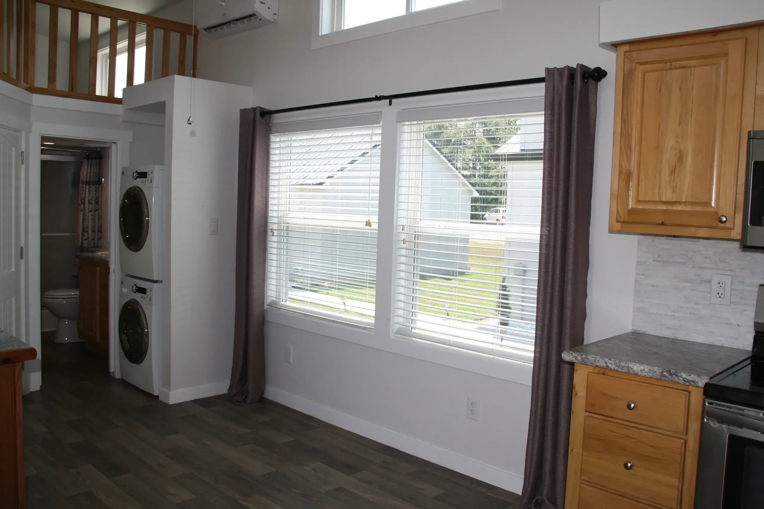 Laundry area with large window view.